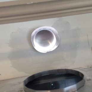 inside wall. cut hole for venting and patched it