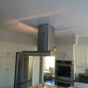 installed new island hood in a kitchen remodel