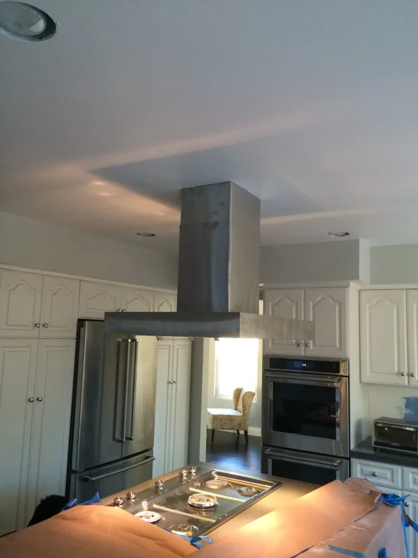 installed new island hood in a kitchen remodel