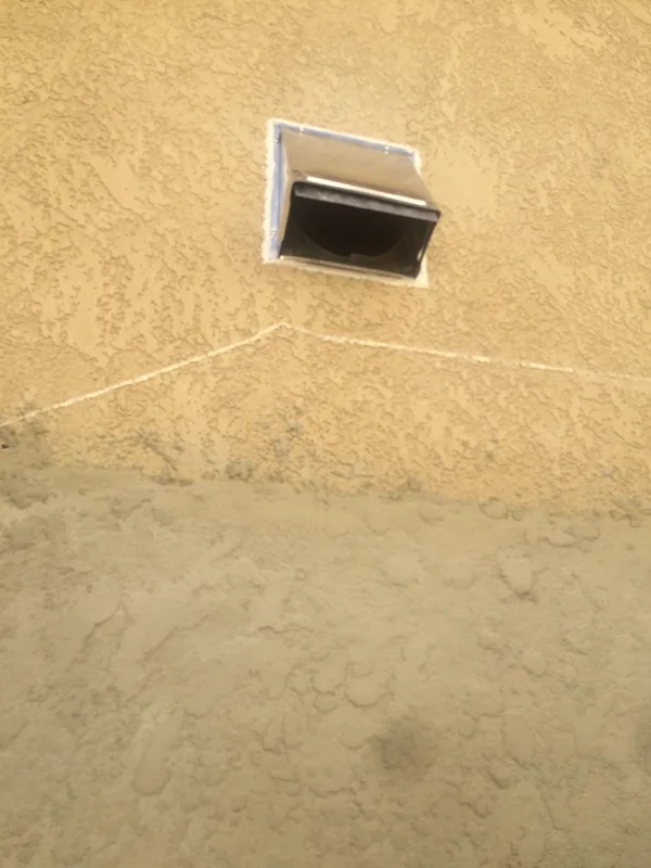 Cut hole in drywall and stucco for venting and installed cap outside