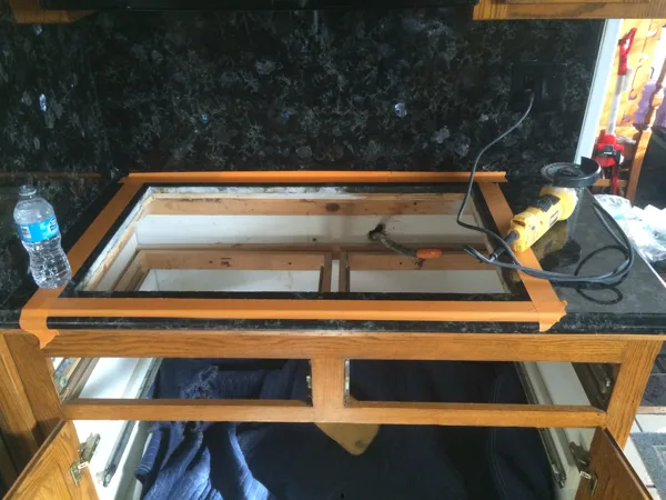 Cut granite counter top larger to fit new cooktop