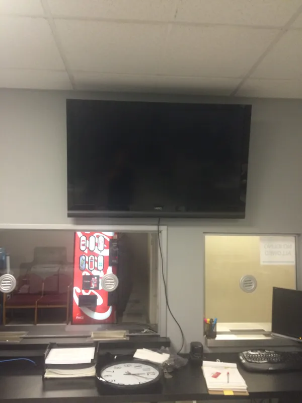 TV wall mount in commercial building. Anchored into metal studs